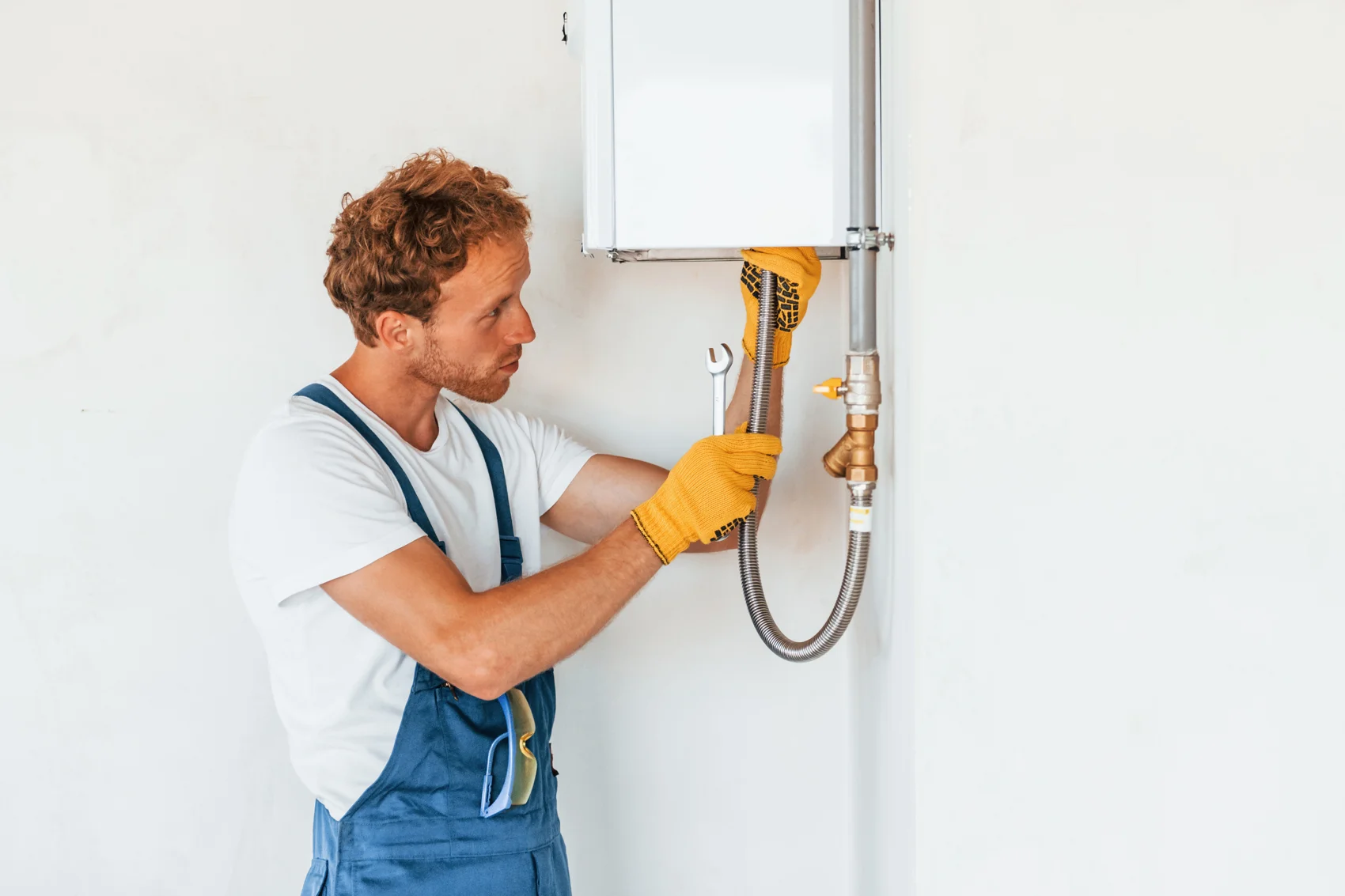 Saffer technician repairing a water heater